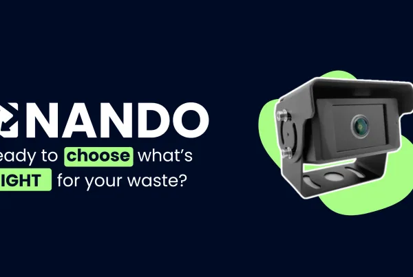 A close-up on a dark blue background of a black, rectangular-shaped camera with a round lens and a mounting bracket, highlighted by an abstract green shape. To the left of the camera is the "NANDO" logo in white, with the text "Ready to choose what's RIGHT for your waste?" in white and green beneath it.