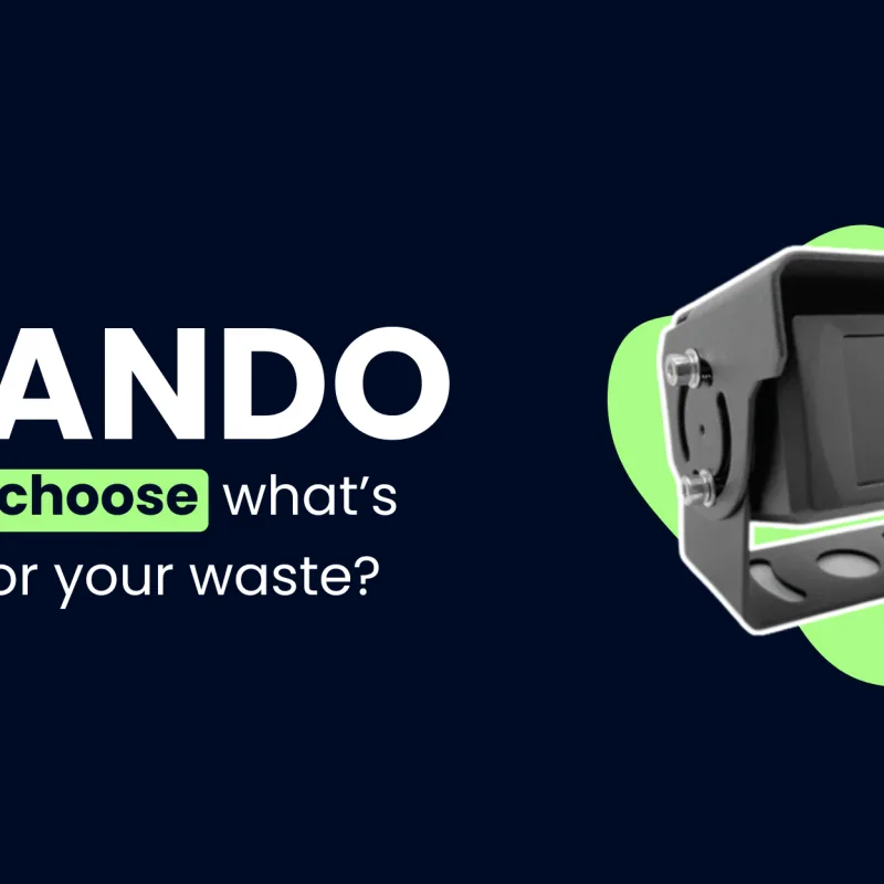 A close-up on a dark blue background of a black, rectangular-shaped camera with a round lens and a mounting bracket, highlighted by an abstract green shape. To the left of the camera is the "NANDO" logo in white, with the text "Ready to choose what's RIGHT for your waste?" in white and green beneath it.